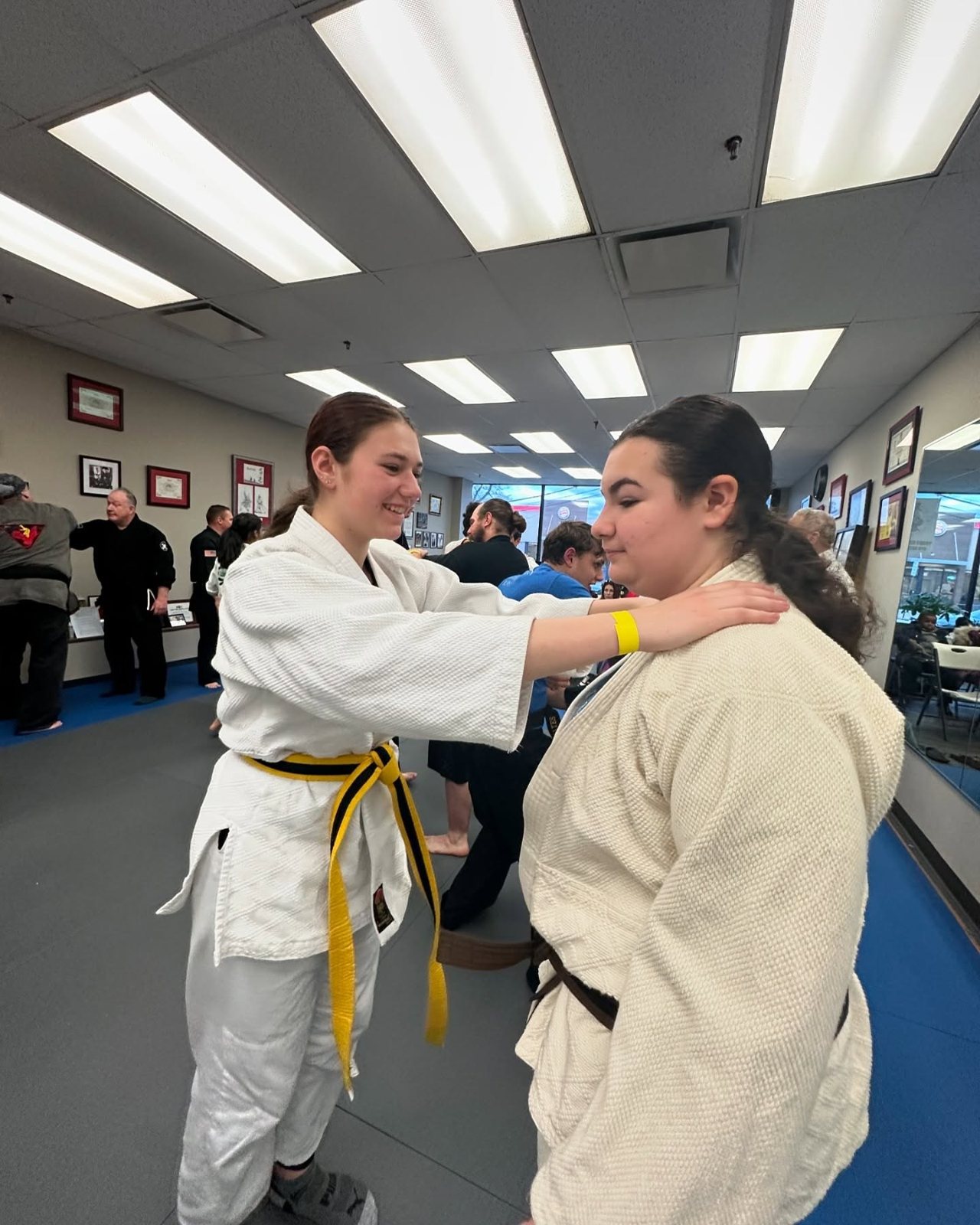 An instructor supervising Self-Defense students closely during class at Master Curry Karate Jujutsu Ryu in Staten Island