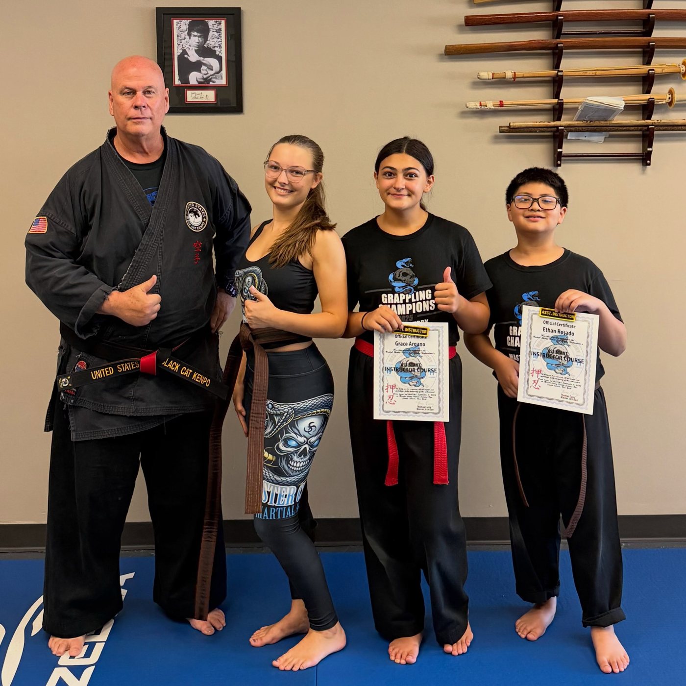 Master Curry with Genevieve and assistant instructors Grace and Ethan after Genevieve's Sanuces Ryu Jujutsu brown belt promotion in Staten Island