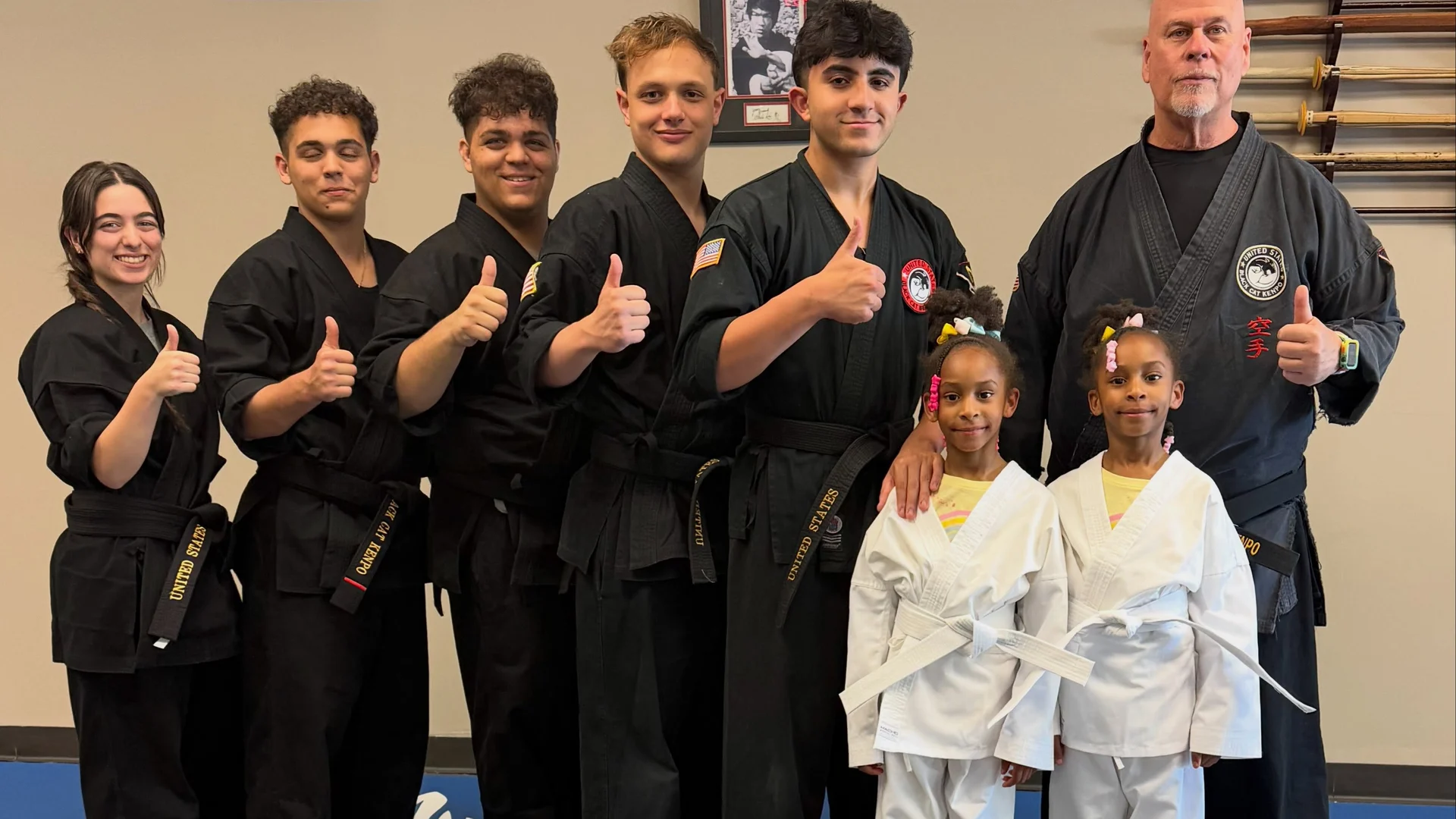 Master Tom Curry demonstrating a jujutsu hold on a student during class at Master Curry Karate Jujutsu Ryu in Staten Island