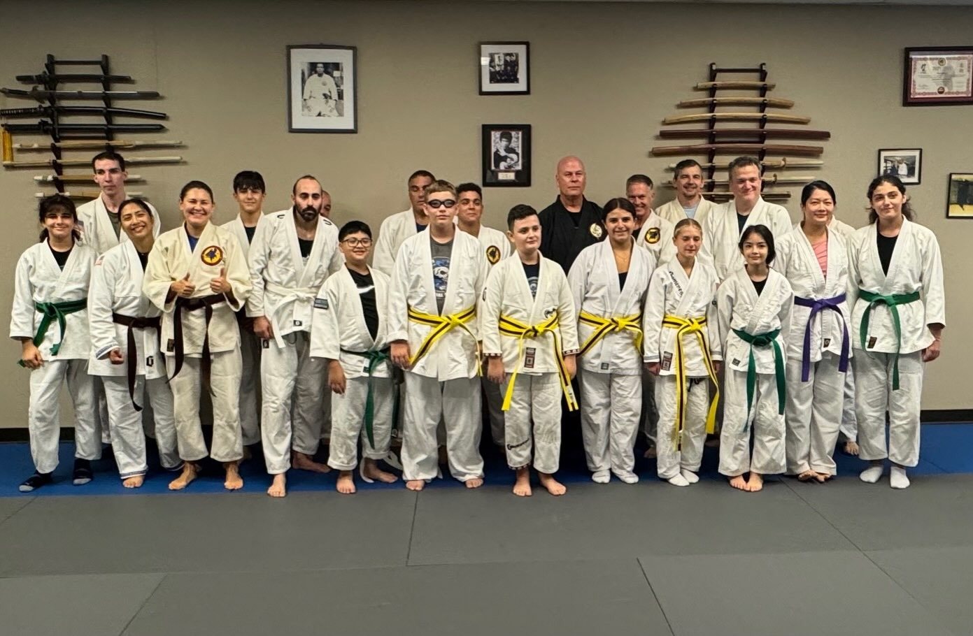 Newly promoted yellow belts lined up with Master Curry after their belt test in Staten Island